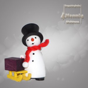 Schneemann mit Schlitten